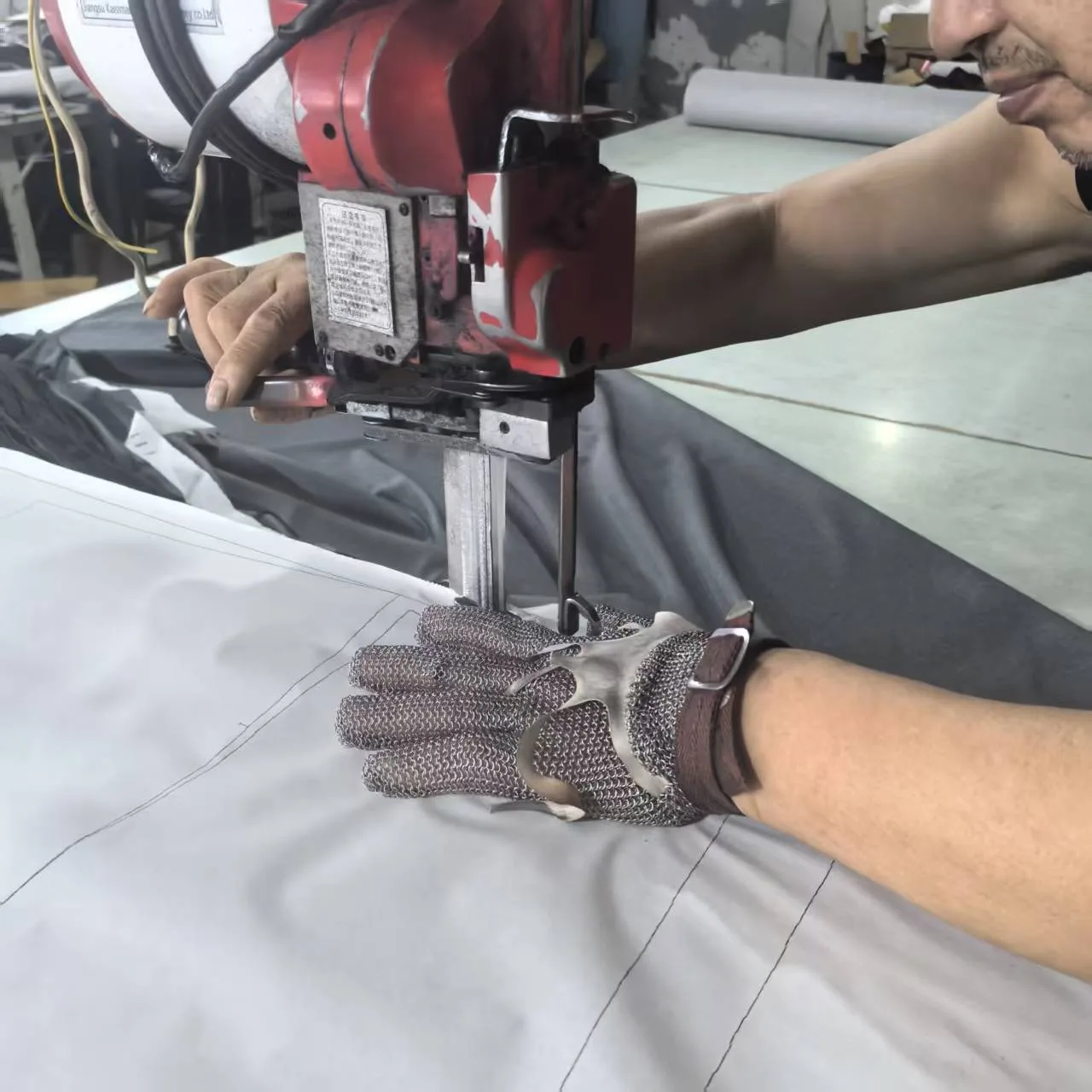Stacked fabric being cut for apparel production