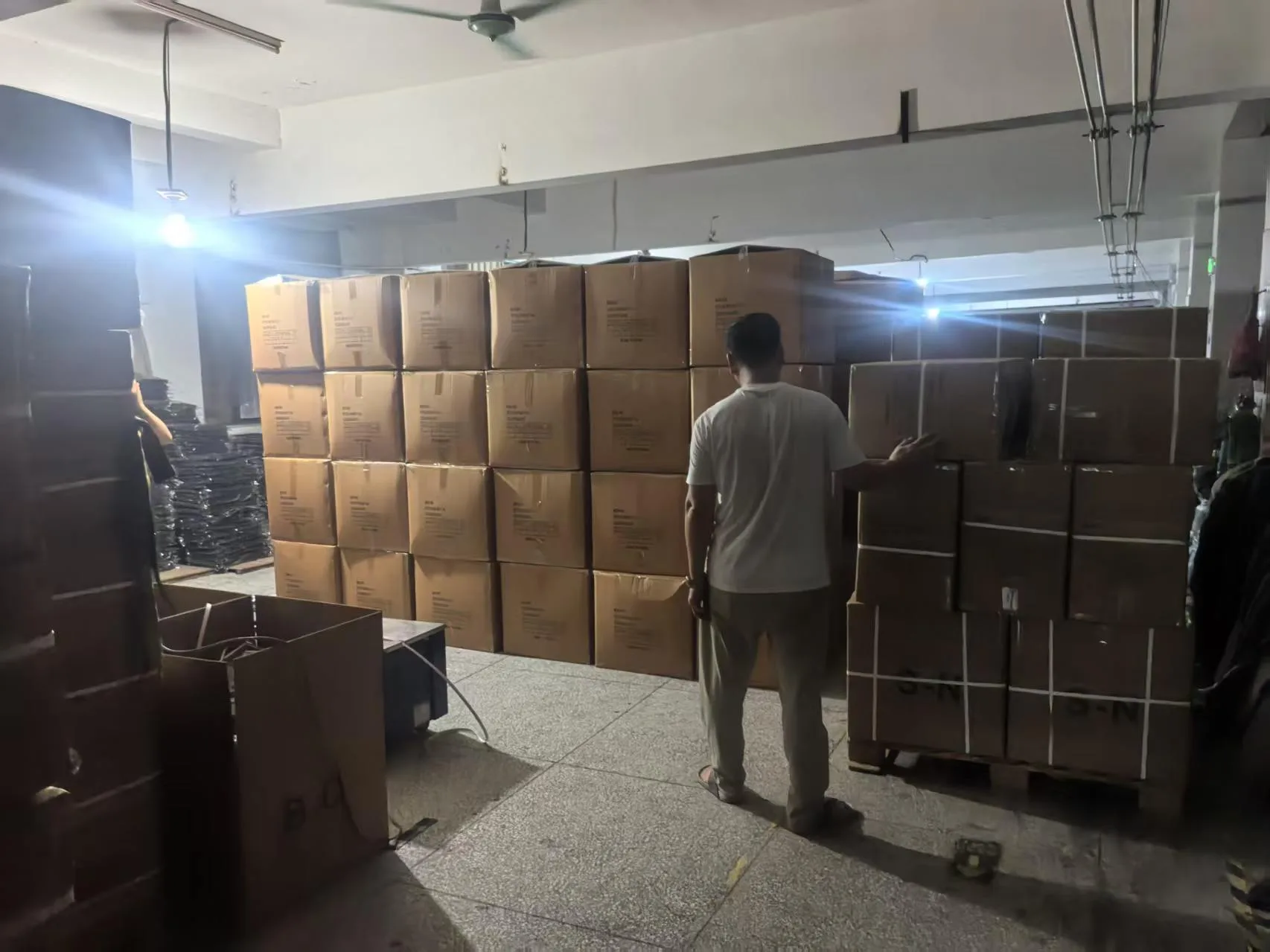 Packed garment cartons staged inside the factory