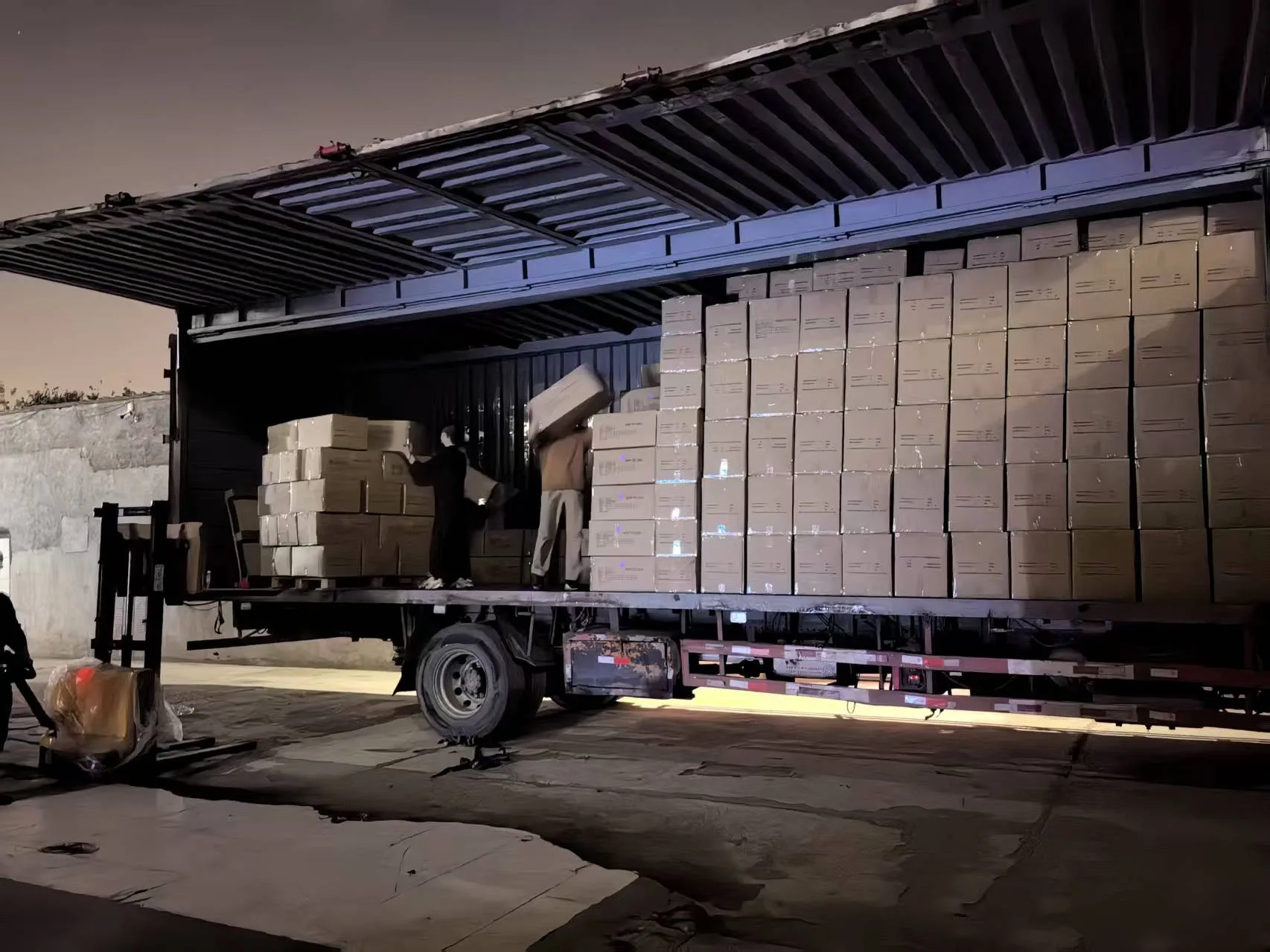 Garment cartons being loaded onto a truck