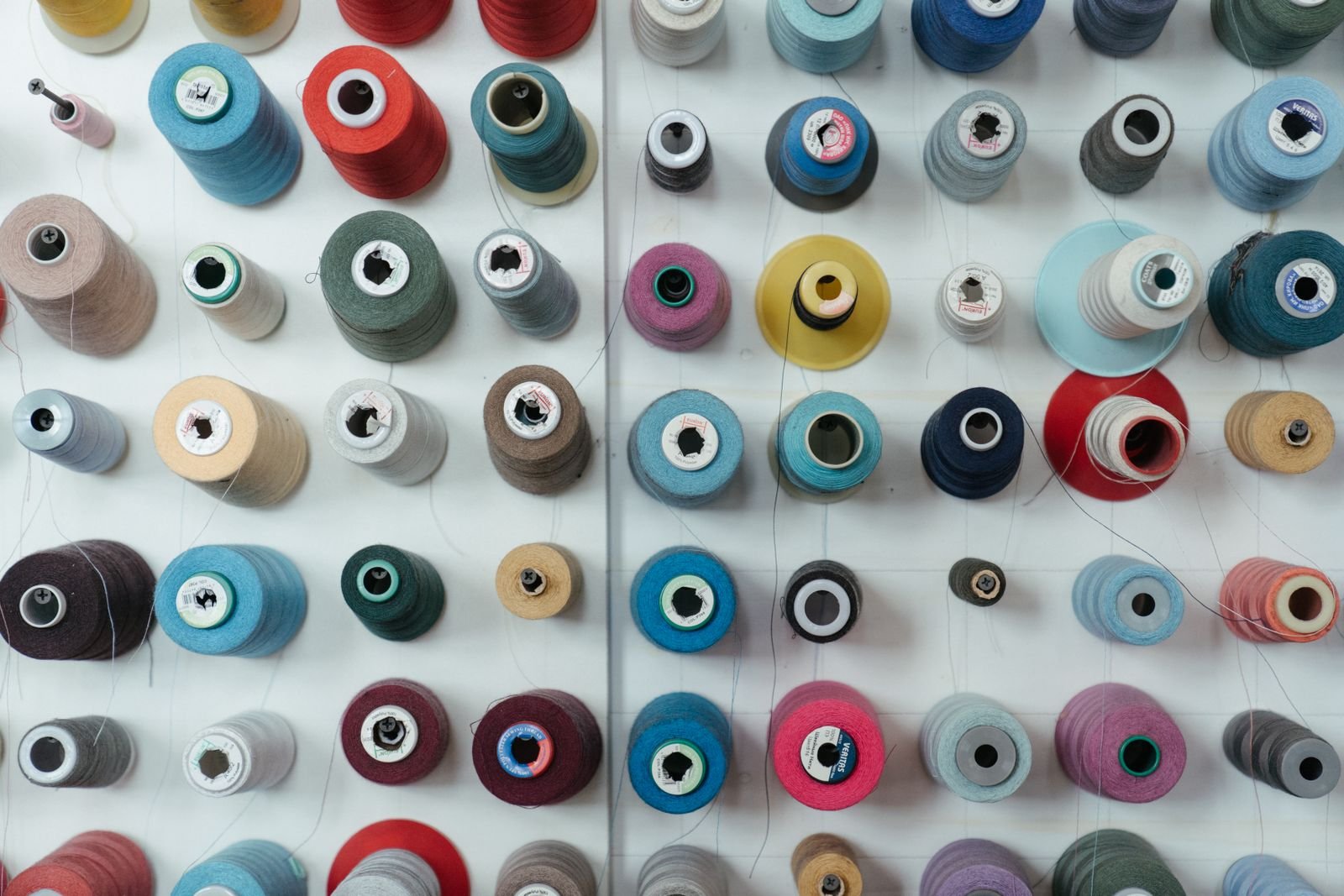 Colorful thread cones used for apparel material and trim development