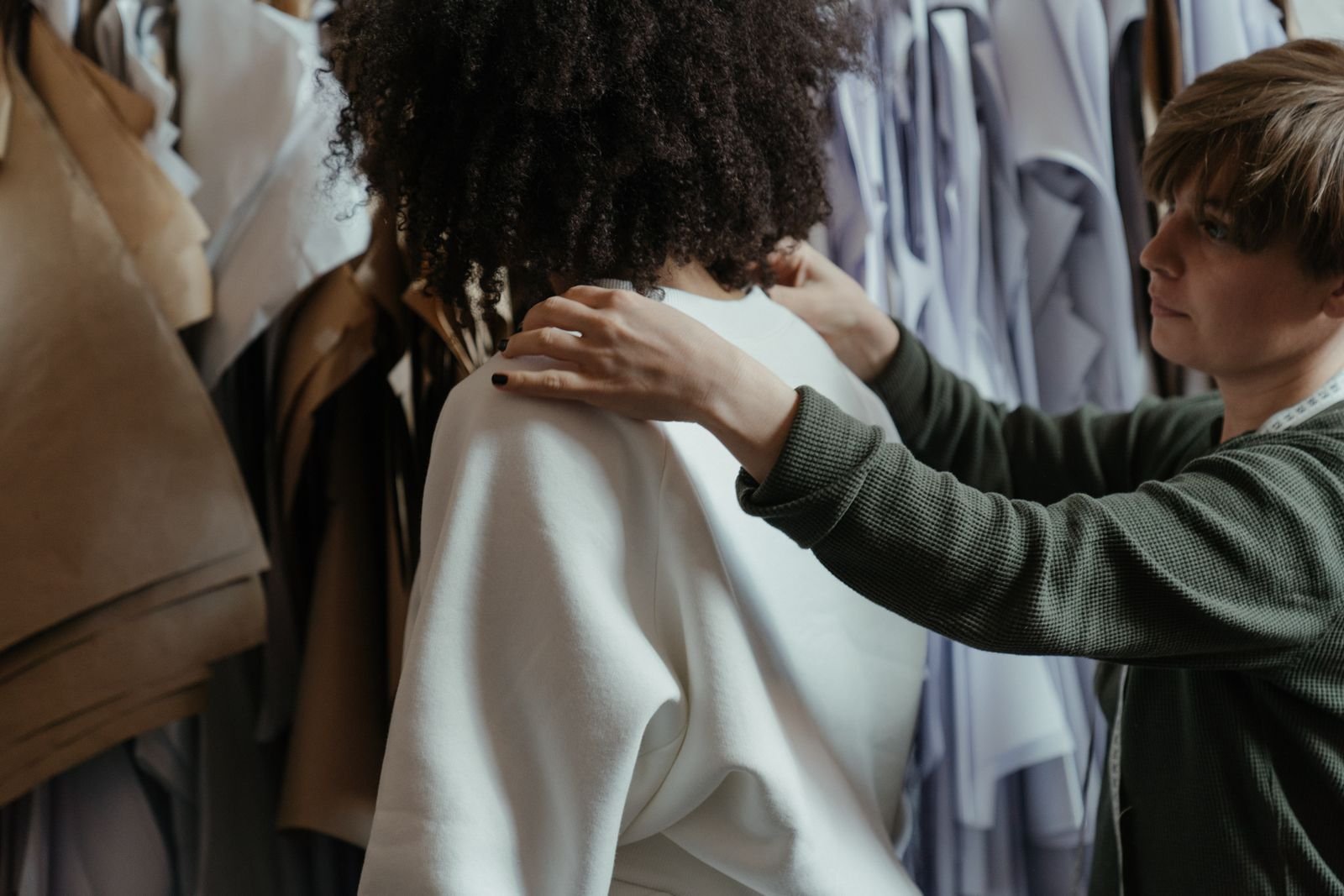 Apparel specialist adjusting the fit of a garment sample