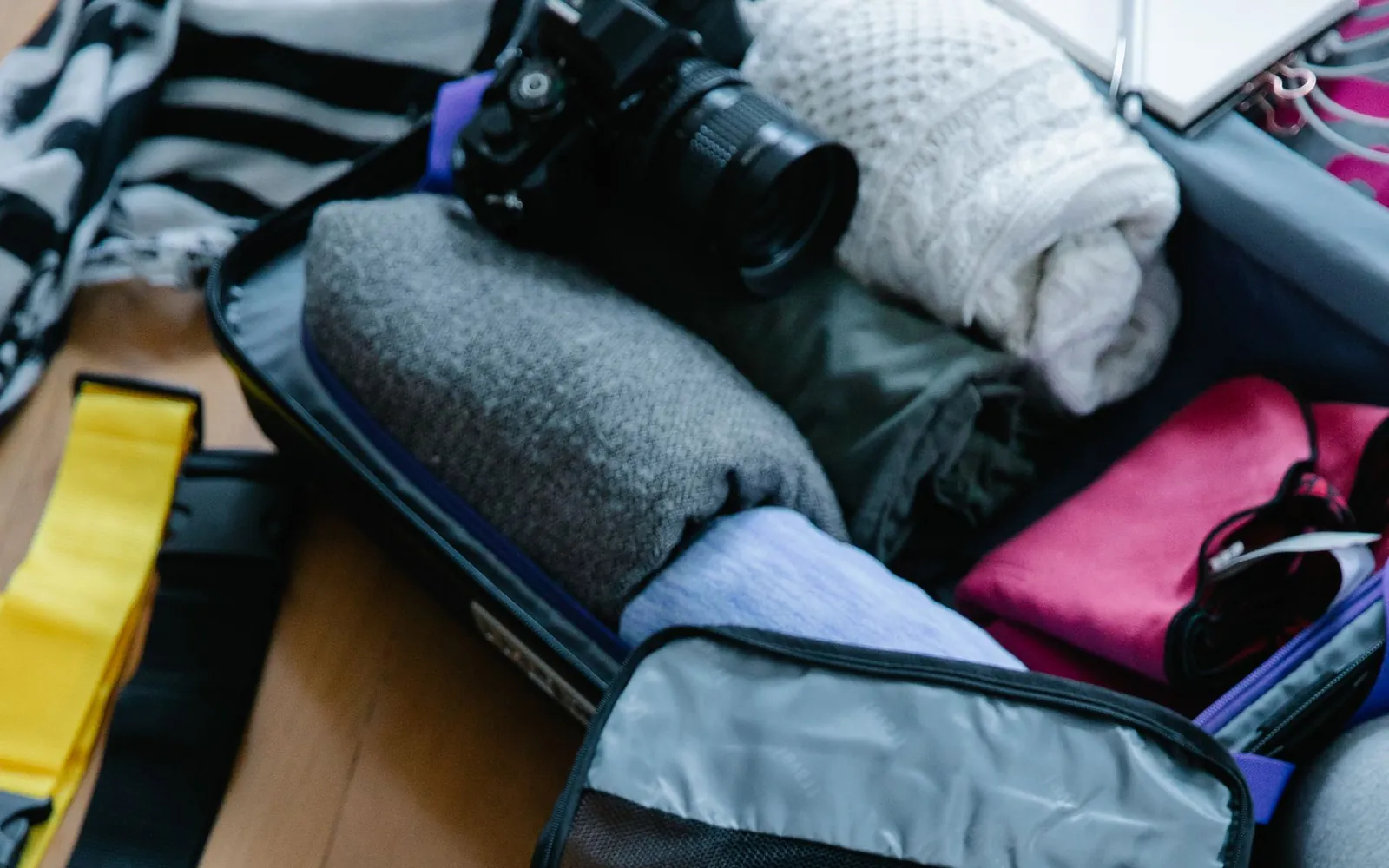 Folded clothing being prepared for packing