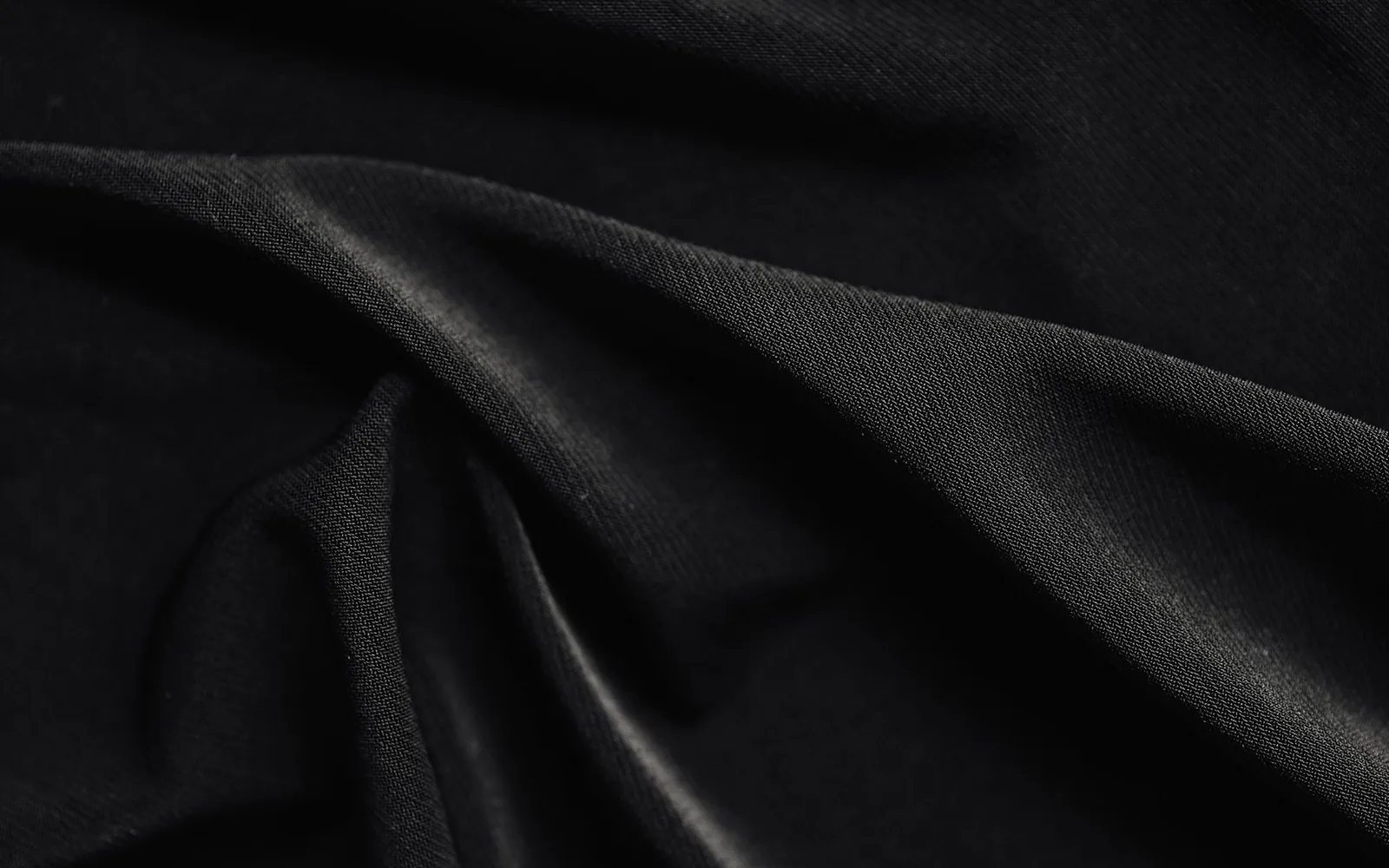 Close-up texture of black apparel fabric