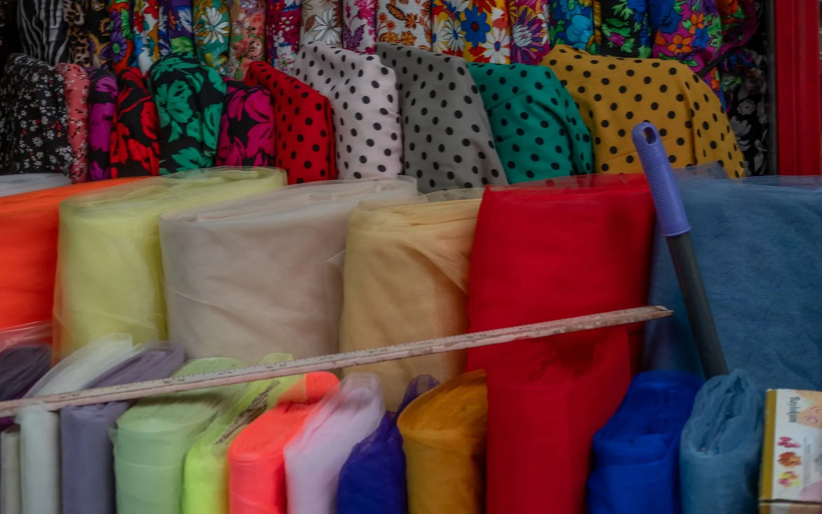 Garments and fabrics displayed for product selection