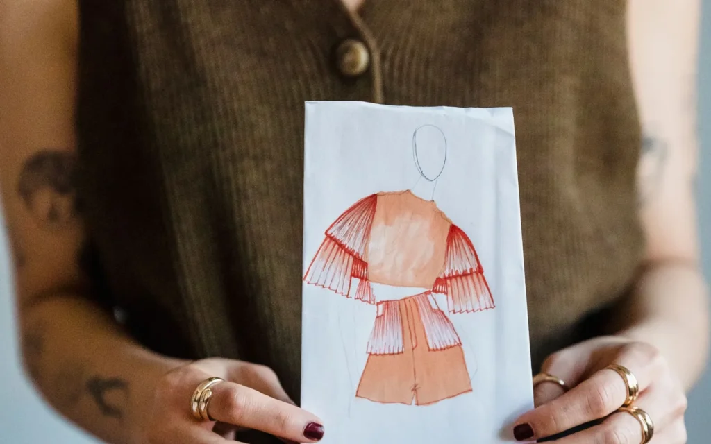 Designer presenting a fashion sketch during product planning