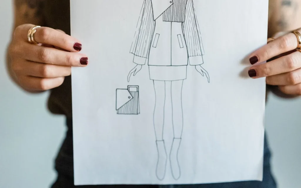 Fashion designer presenting a garment sketch